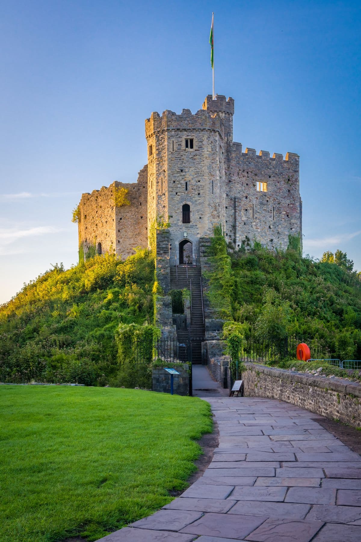 The keep of Cardiff Castle with the Welsh flag flying