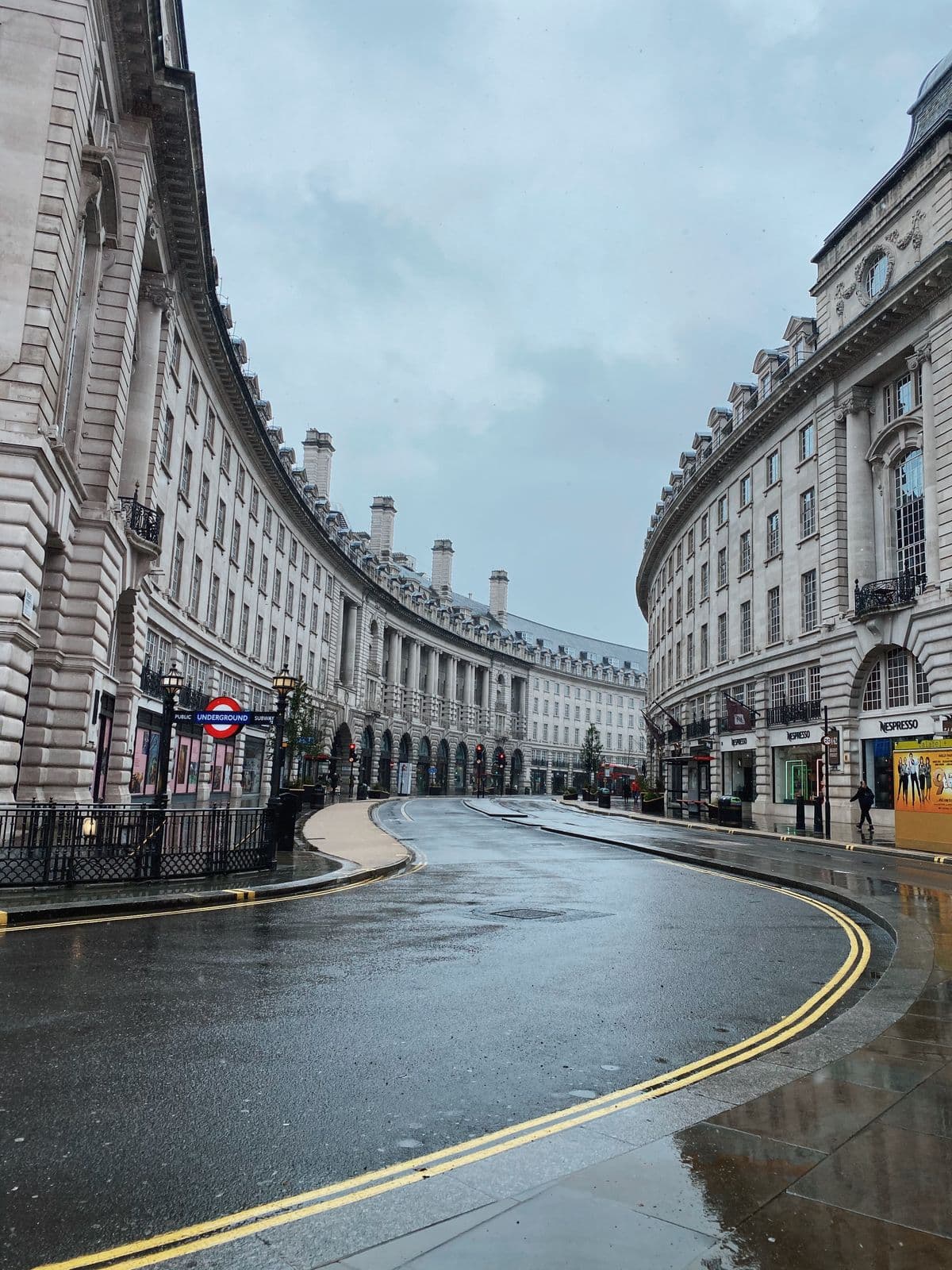 Regent Street's curved colonnade in central London on a wet day